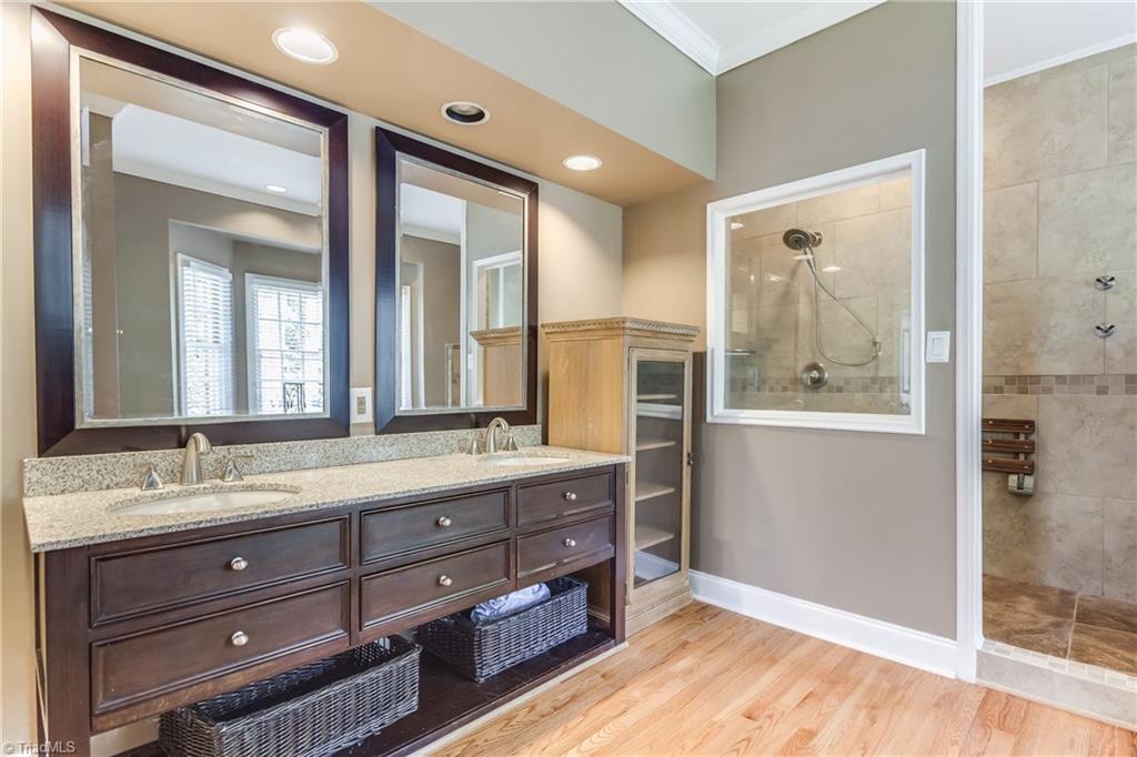 3605 Gaston Road Greensboro, NC 27407 - Photo 16 of 30 Updated Master Bath in 2015 - double sinks, granite tops, open & tiled shower, jetted tub.