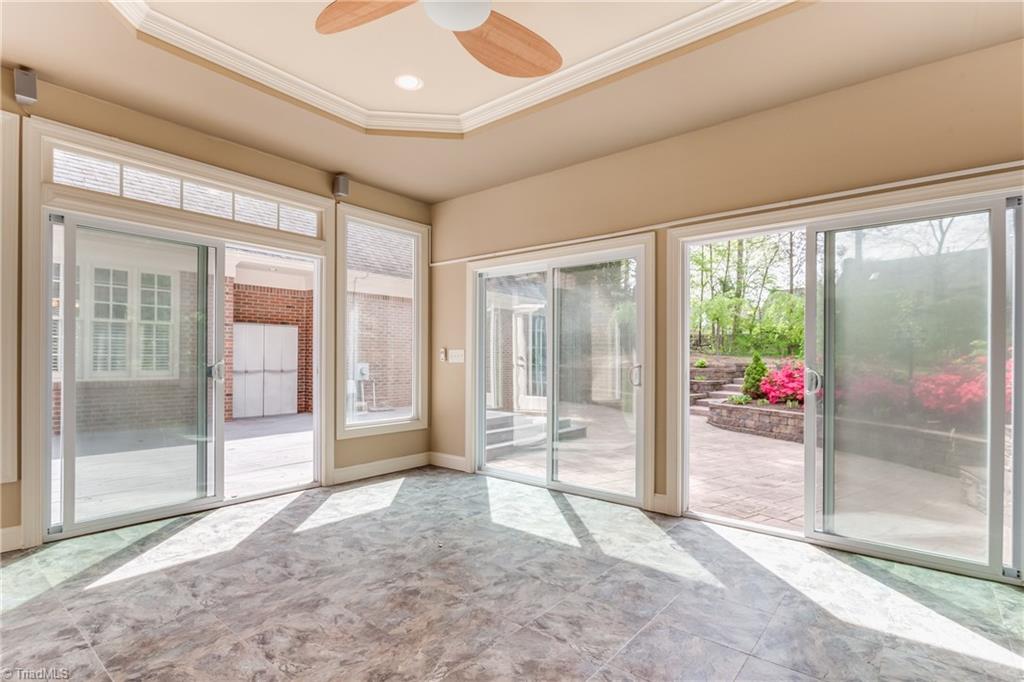 3605 Gaston Road Greensboro, NC 27407 - Photo 22 of 30 Sunroom off Master Bedroom w/access to deck and backyard.