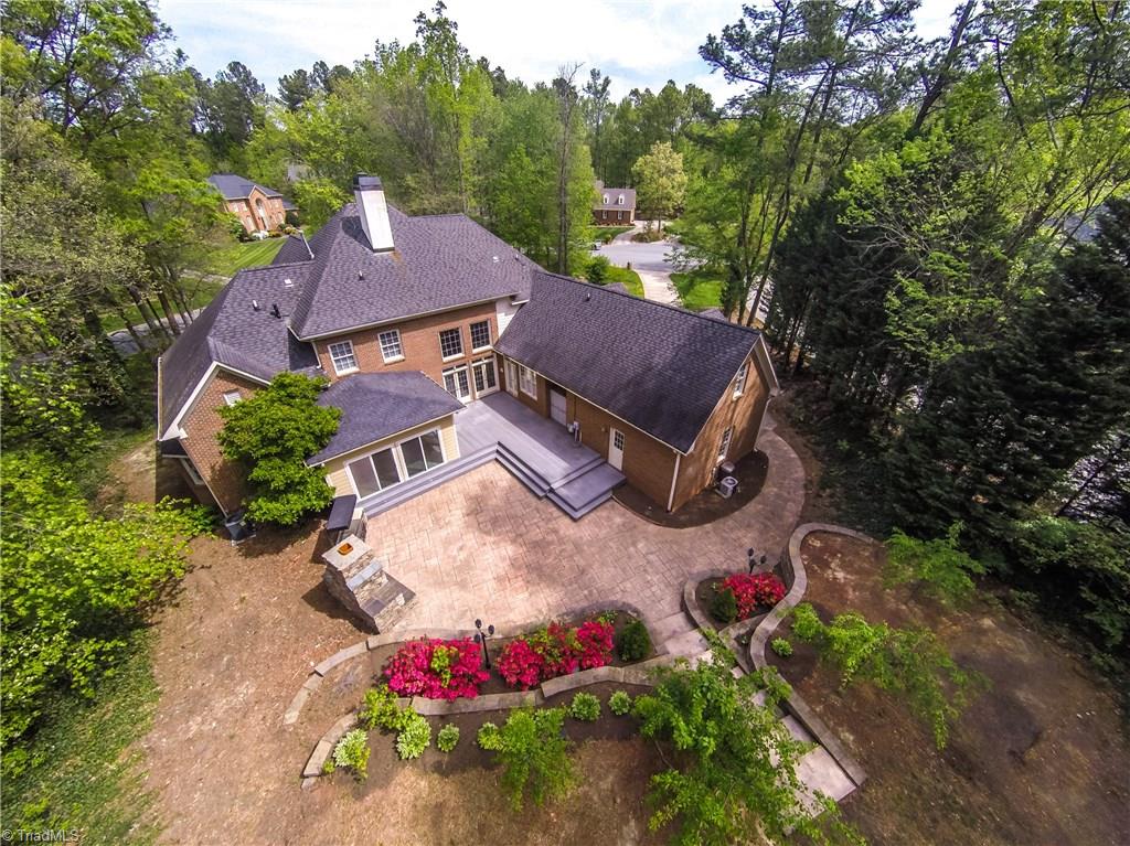3605 Gaston Road Greensboro, NC 27407 - Photo 28 of 30 Home situated among mature trees w/beautiful landscaping.