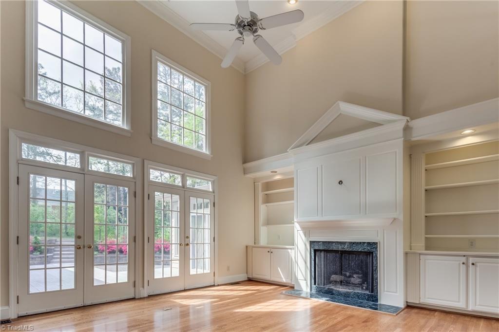 3605 Gaston Road Greensboro, NC 27407 - Photo 6 of 30 Great Room looks and opens out onto backyard oasis through these beautiful french doors and large windows.