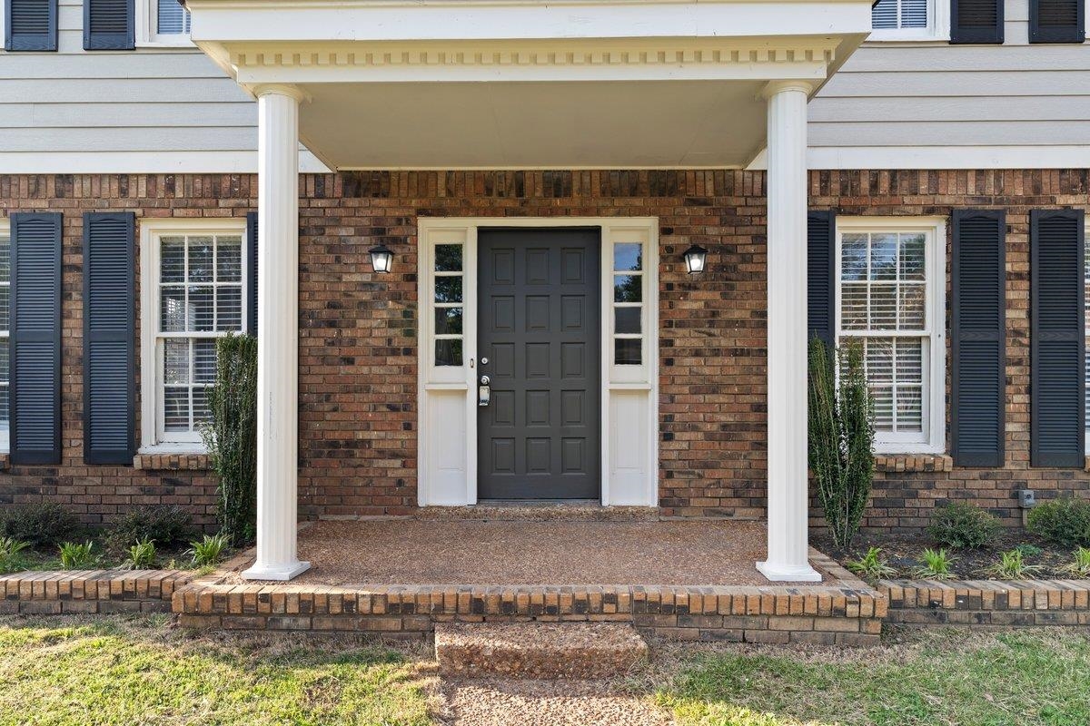 6010 Fox Ridge Drive Memphis, TN 38115 - Photo 4 of 34 Entrance to property with a porch and brick siding