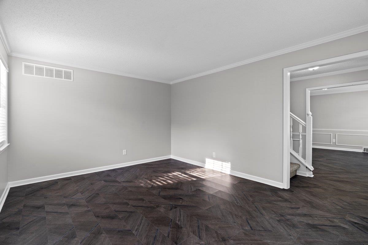 6010 Fox Ridge Drive Memphis, TN 38115 - Photo 6 of 34 Unfurnished room featuring parquet floors and crown molding