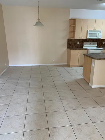 a kitchen with a cabinets and a stove top oven