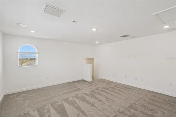 an empty room with a empty space and a window