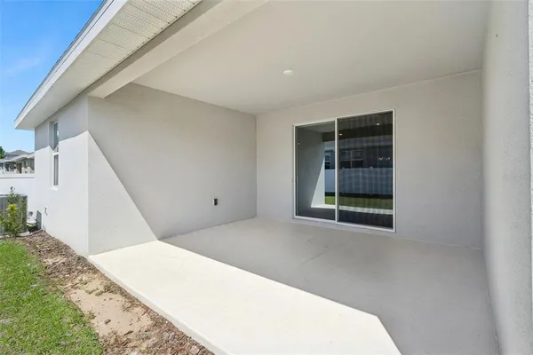 a view of an empty room with windows