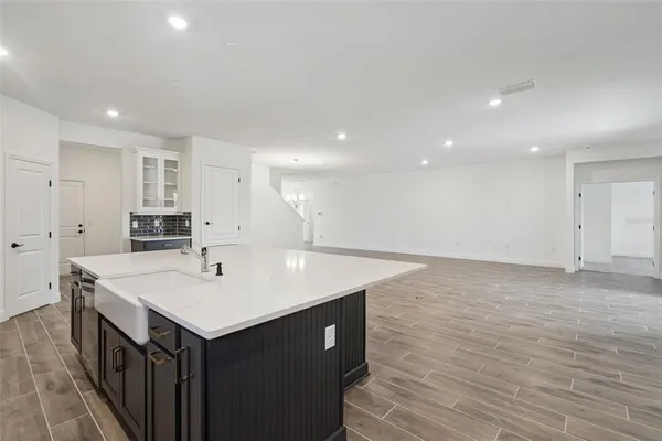 a kitchen with a sink and a refrigerator