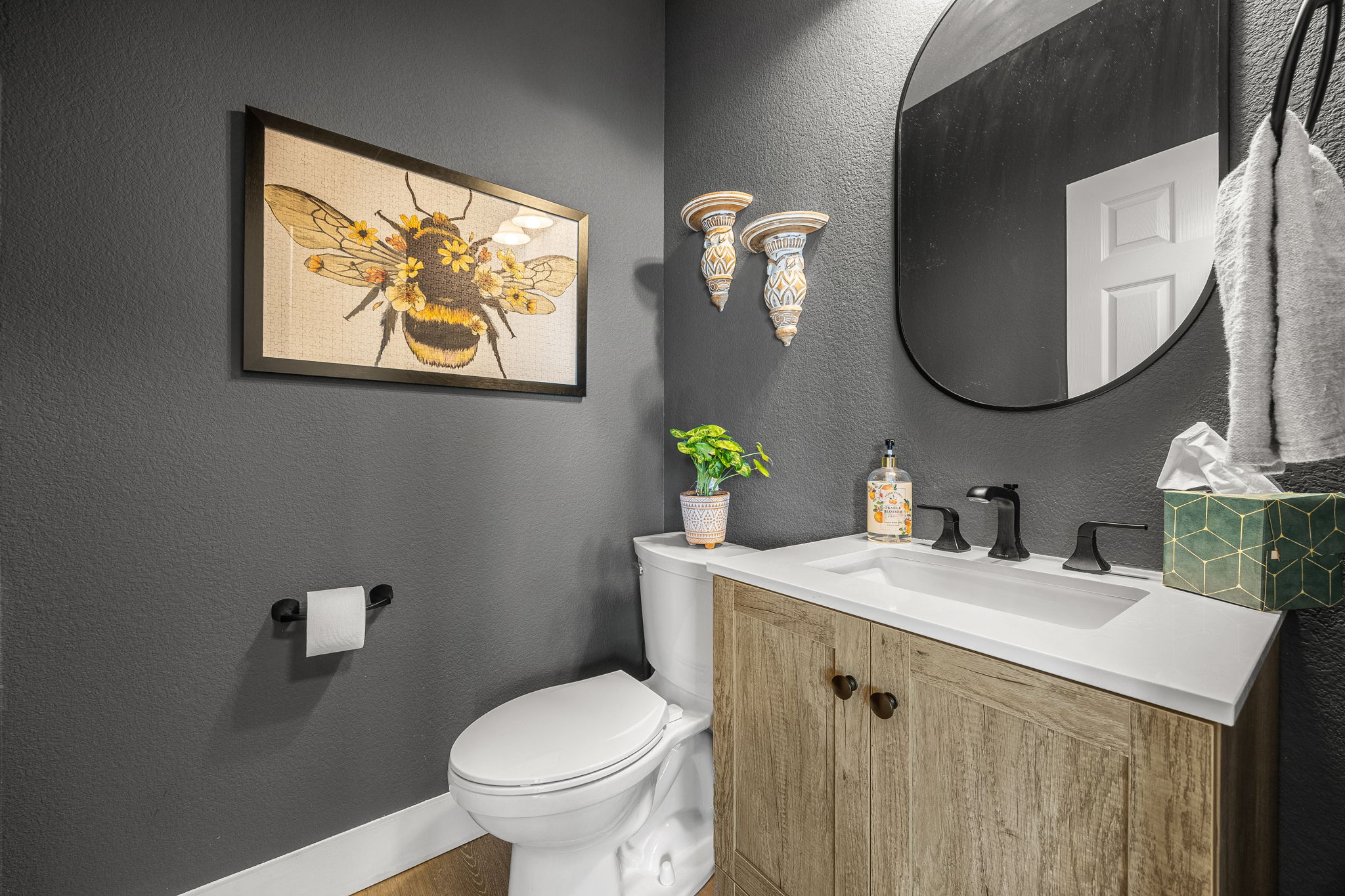 128 Las Colinas Drive Georgetown, TX 78628 - Photo 14 of 38 a bathroom with a toilet a sink and mirror