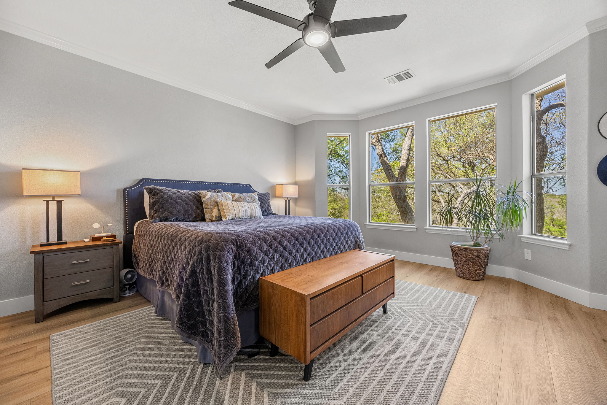 128 Las Colinas Drive Georgetown, TX 78628 - Photo 17 of 38 a bedroom with a large bed and a large window
