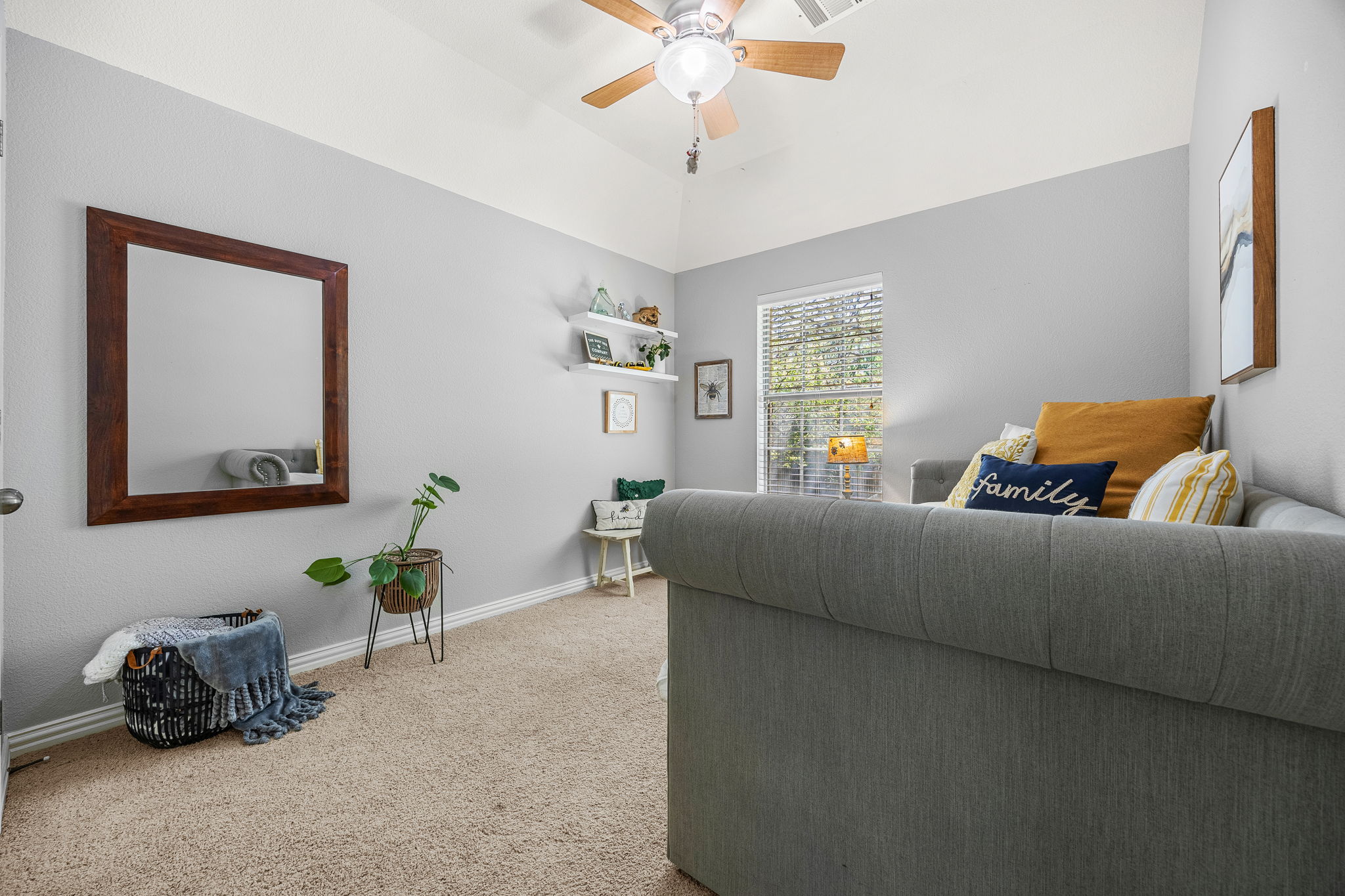 128 Las Colinas Drive Georgetown, TX 78628 - Photo 23 of 38 a living room with furniture and a potted plant