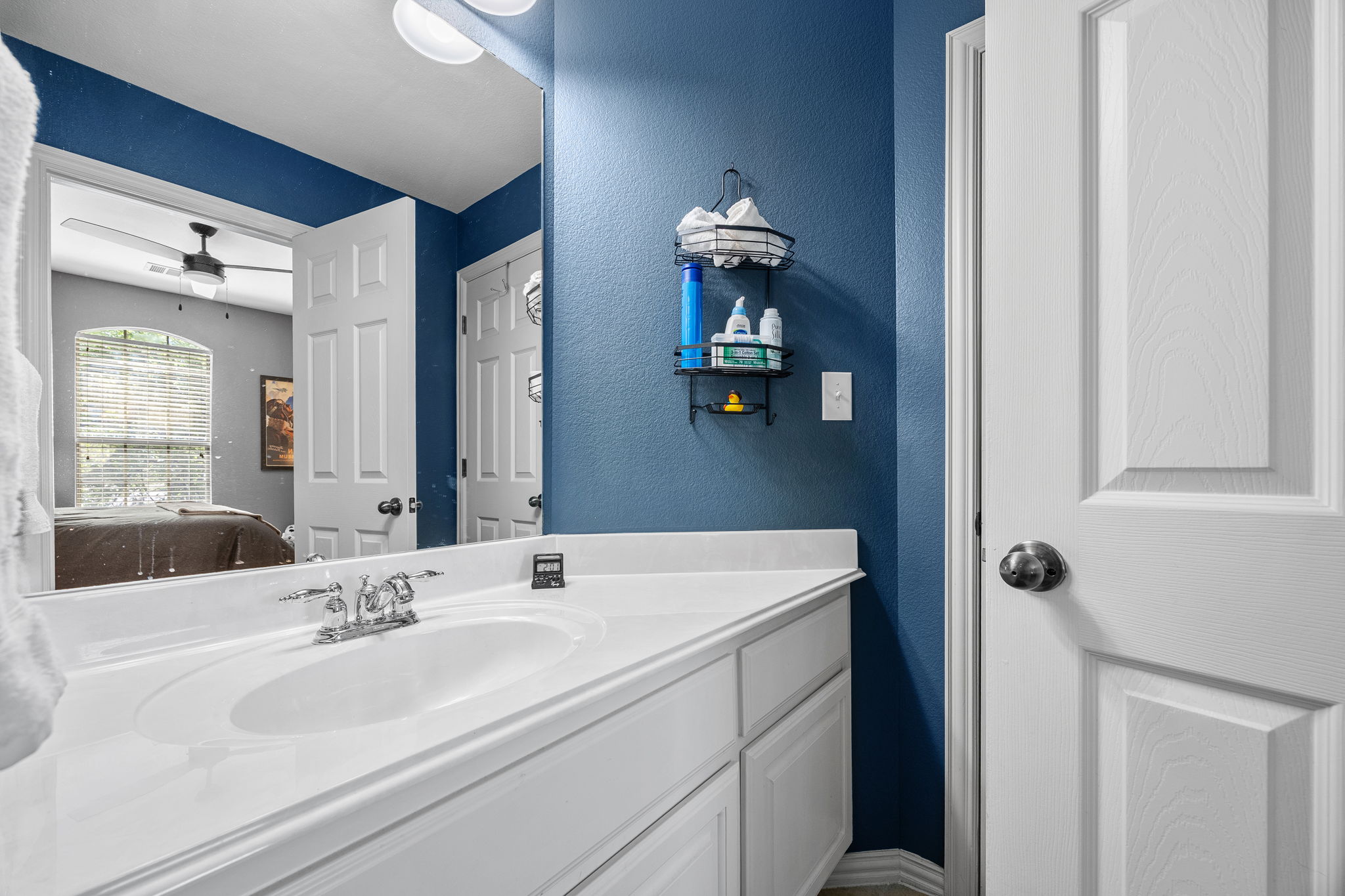 128 Las Colinas Drive Georgetown, TX 78628 - Photo 24 of 38 a bathroom with a sink and a mirror