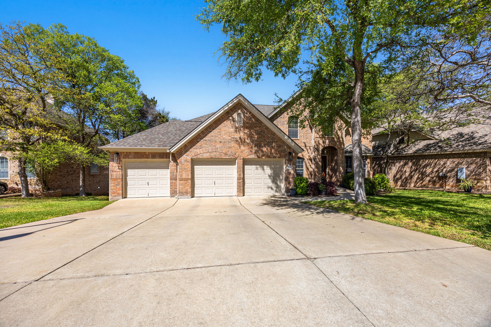 128 Las Colinas Drive Georgetown, TX 78628 - Photo 27 of 38 a view of a house with a yard and large trees