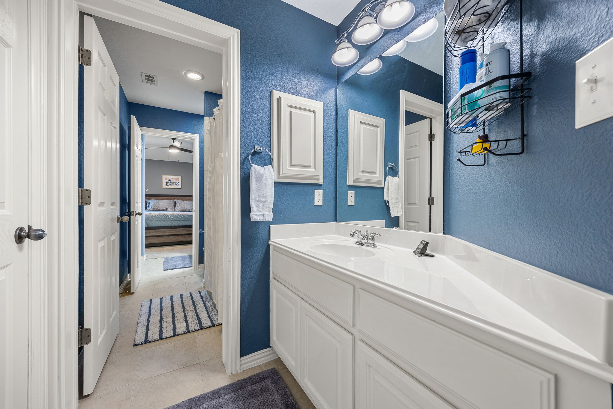 128 Las Colinas Drive Georgetown, TX 78628 - Photo 28 of 38 a bathroom with a sink and a mirror