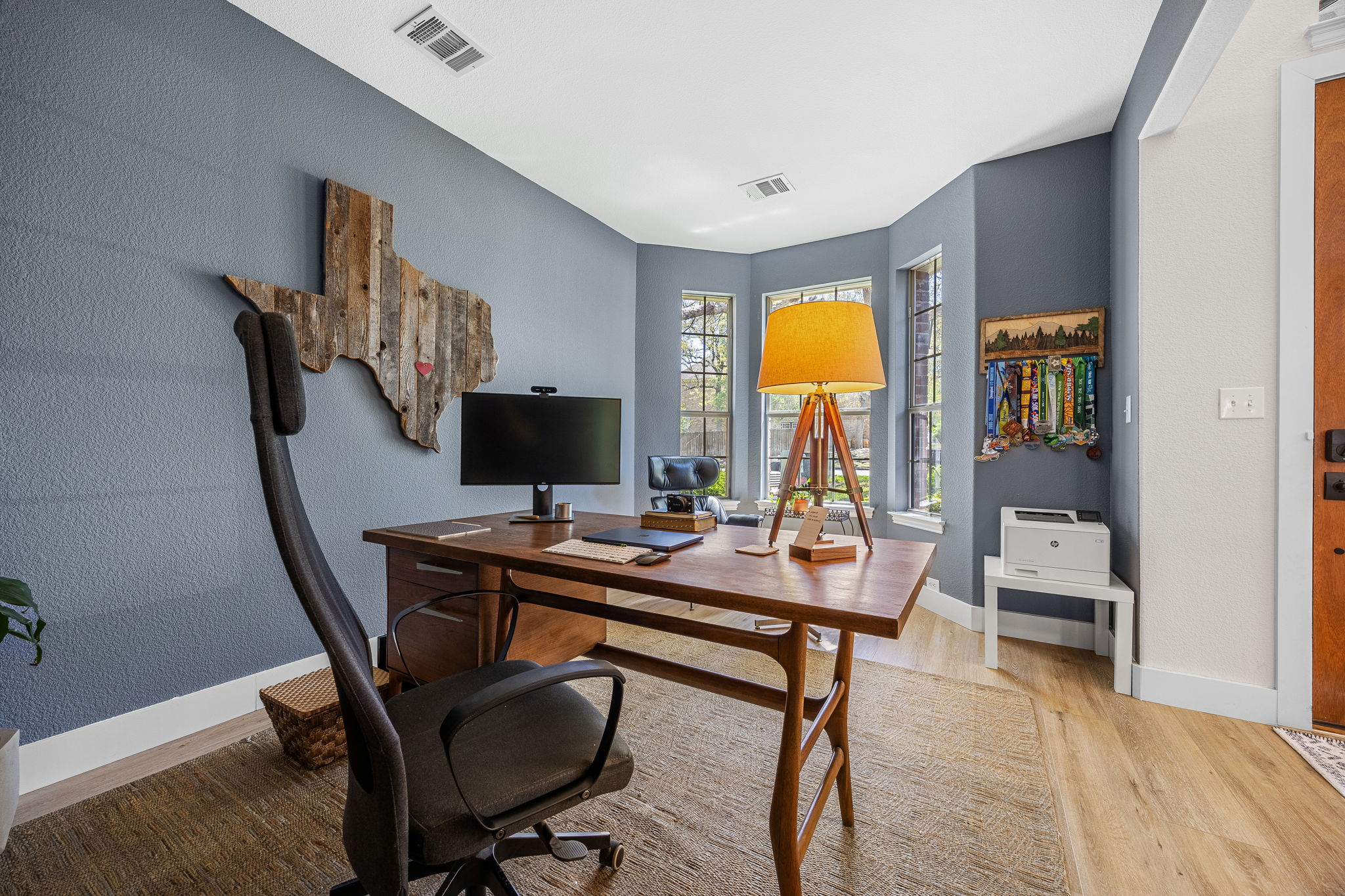 128 Las Colinas Drive Georgetown, TX 78628 - Photo 3 of 38 a view of a workspace with furniture and a window
