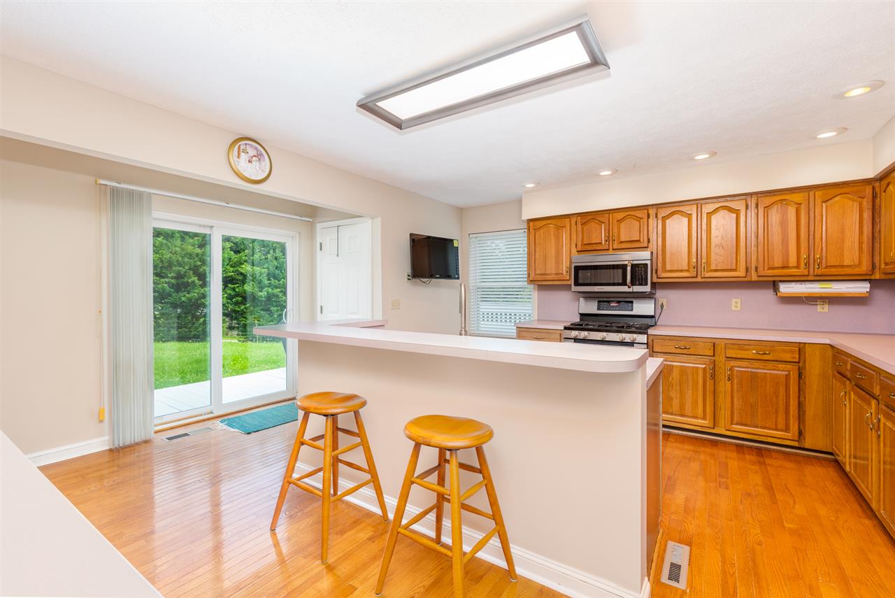 285 Fadley Road Weyers Cave, VA 24486 - Photo 8 of 30 a kitchen with stainless steel appliances granite countertop a stove a sink and a microwave