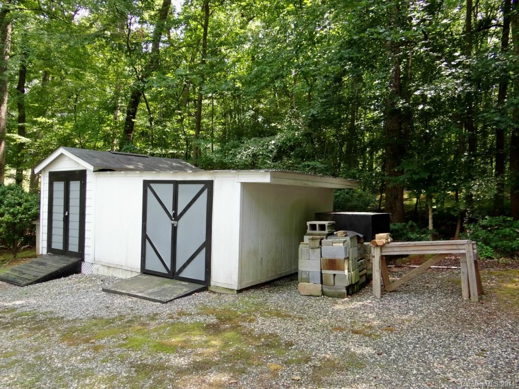 459 Loray Farm Road Dallas, NC 28034 - Photo 14 of 14 a backyard of a house with yard barbeque oven and a table