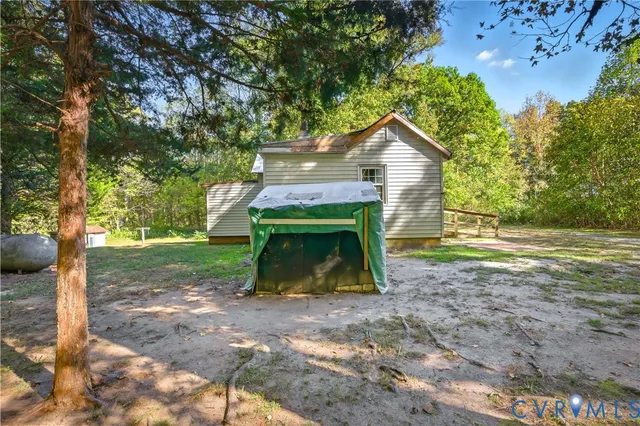 a view of a tree with a yard