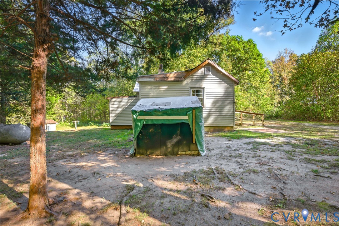 5636 Cartersville Road Powhatan, VA 23139 - Photo 12 of 32 a view of a small house with a yard