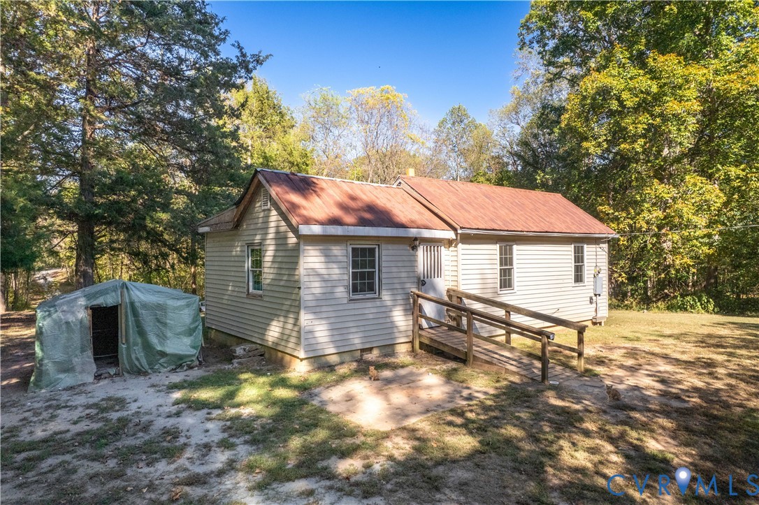 5636 Cartersville Road Powhatan, VA 23139 - Photo 32 of 32 a view of a house with a yard and wooden fence