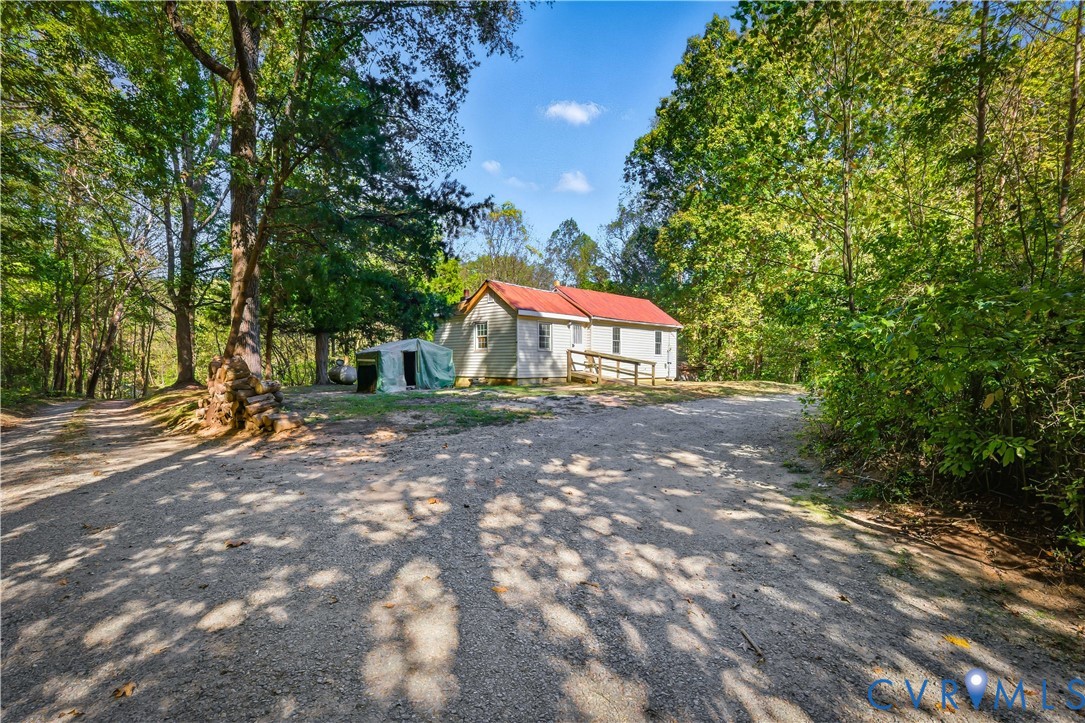 5636 Cartersville Road Powhatan, VA 23139 - Photo 5 of 32 a house with lots of trees