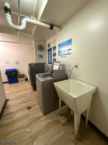 277 Prospect Avenue, Unit H Hackensack, NJ 07601 - Photo 15 of 25 a view of a room with gym equipment