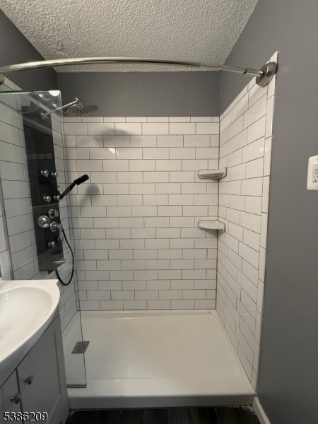 277 Prospect Avenue, Unit H Hackensack, NJ 07601 - Photo 20 of 25 a bathroom with a shower and a sink
