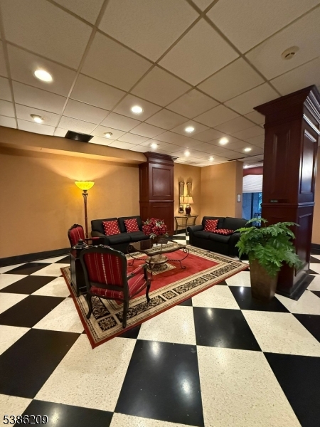 277 Prospect Avenue, Unit H Hackensack, NJ 07601 - Photo 2 of 25 a room with lots of chairs and mirrors