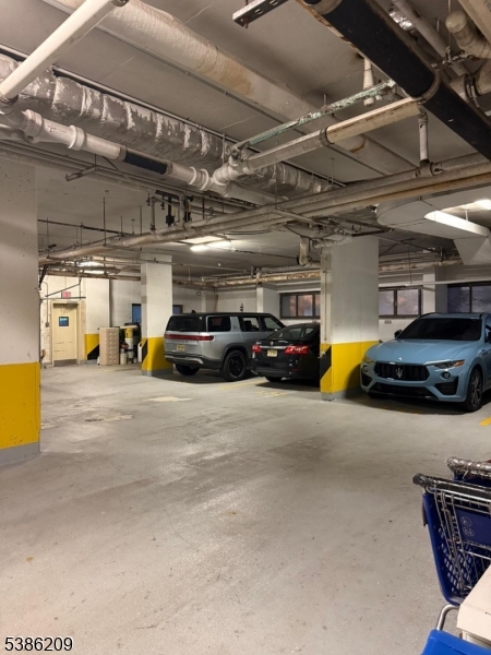 277 Prospect Avenue, Unit H Hackensack, NJ 07601 - Photo 23 of 25 a view of parking garage with cars