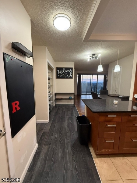 277 Prospect Avenue, Unit H Hackensack, NJ 07601 - Photo 5 of 25 a view of a kitchen with stainless steel appliances granite countertop a stove and a refrigerator