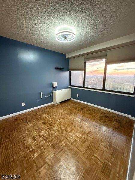 277 Prospect Avenue, Unit H Hackensack, NJ 07601 - Photo 6 of 25 a view of an empty room and window