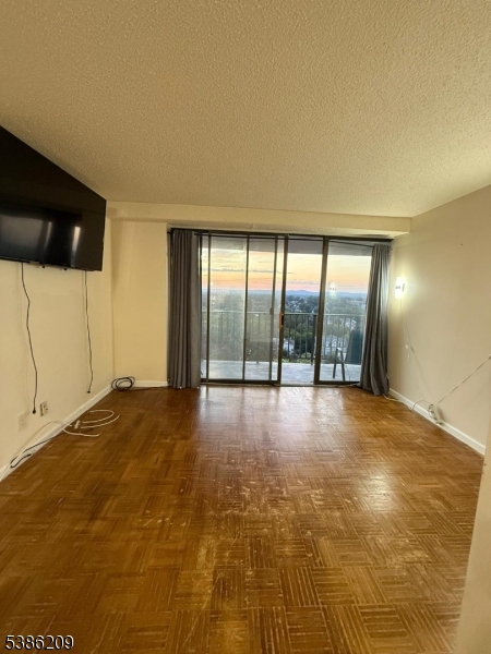 277 Prospect Avenue, Unit H Hackensack, NJ 07601 - Photo 7 of 25 a view of an empty room with a windows