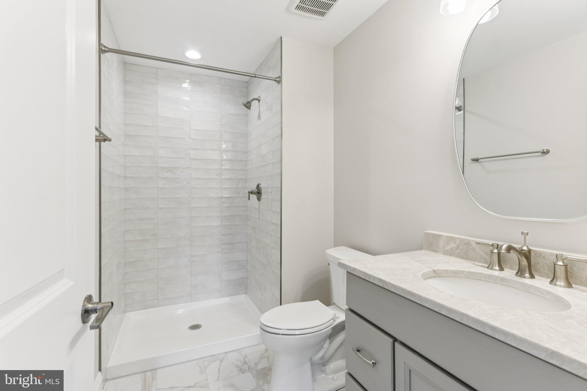 510 Newcomen Road, Unit B3D Exton, PA 19341 - Photo 64 of 74 a bathroom with a granite countertop sink toilet and shower