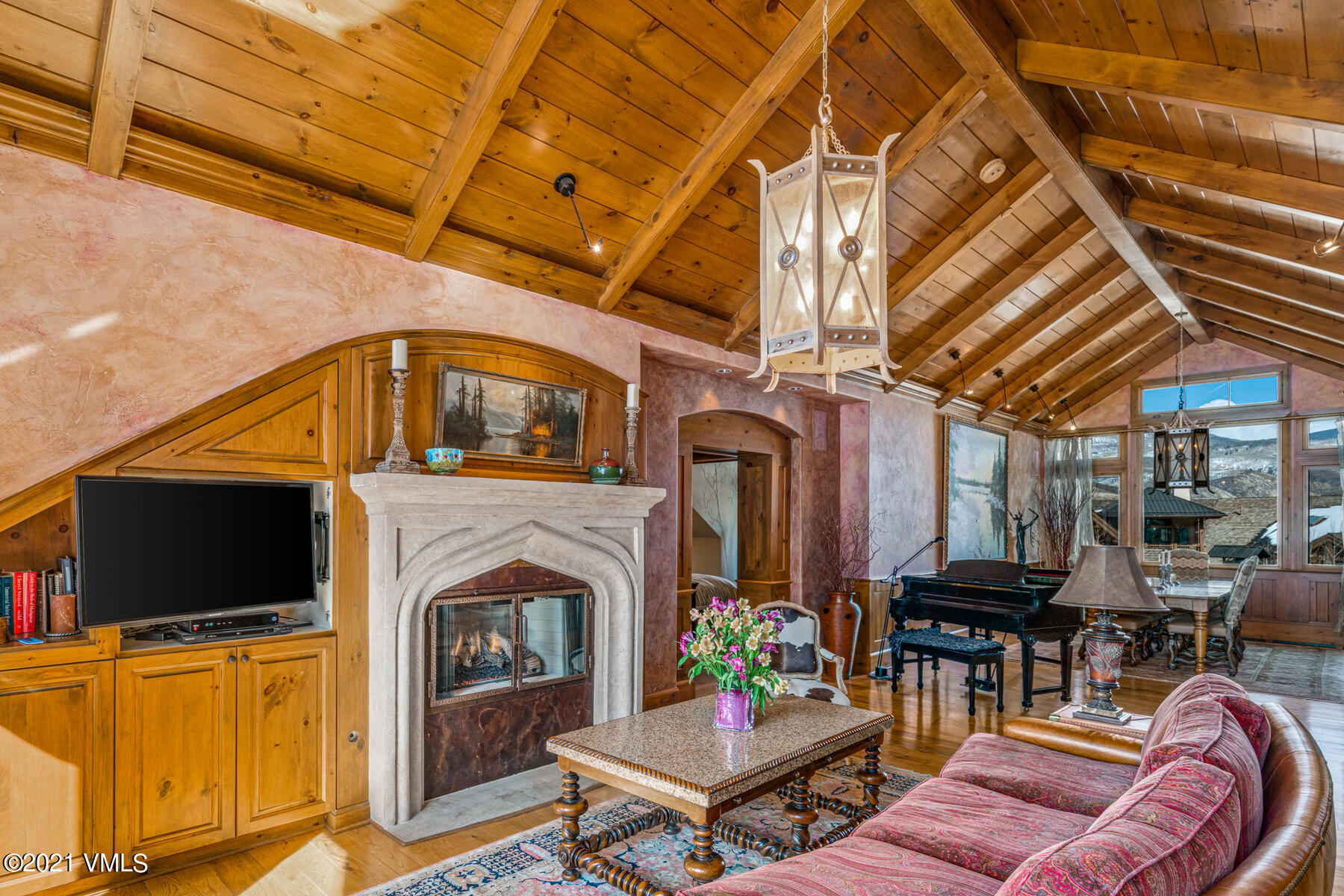 160 Cresta Road, Unit R501 Edwards, CO 81632 - Photo 11 of 21 a living room with furniture a flat screen tv and a fireplace