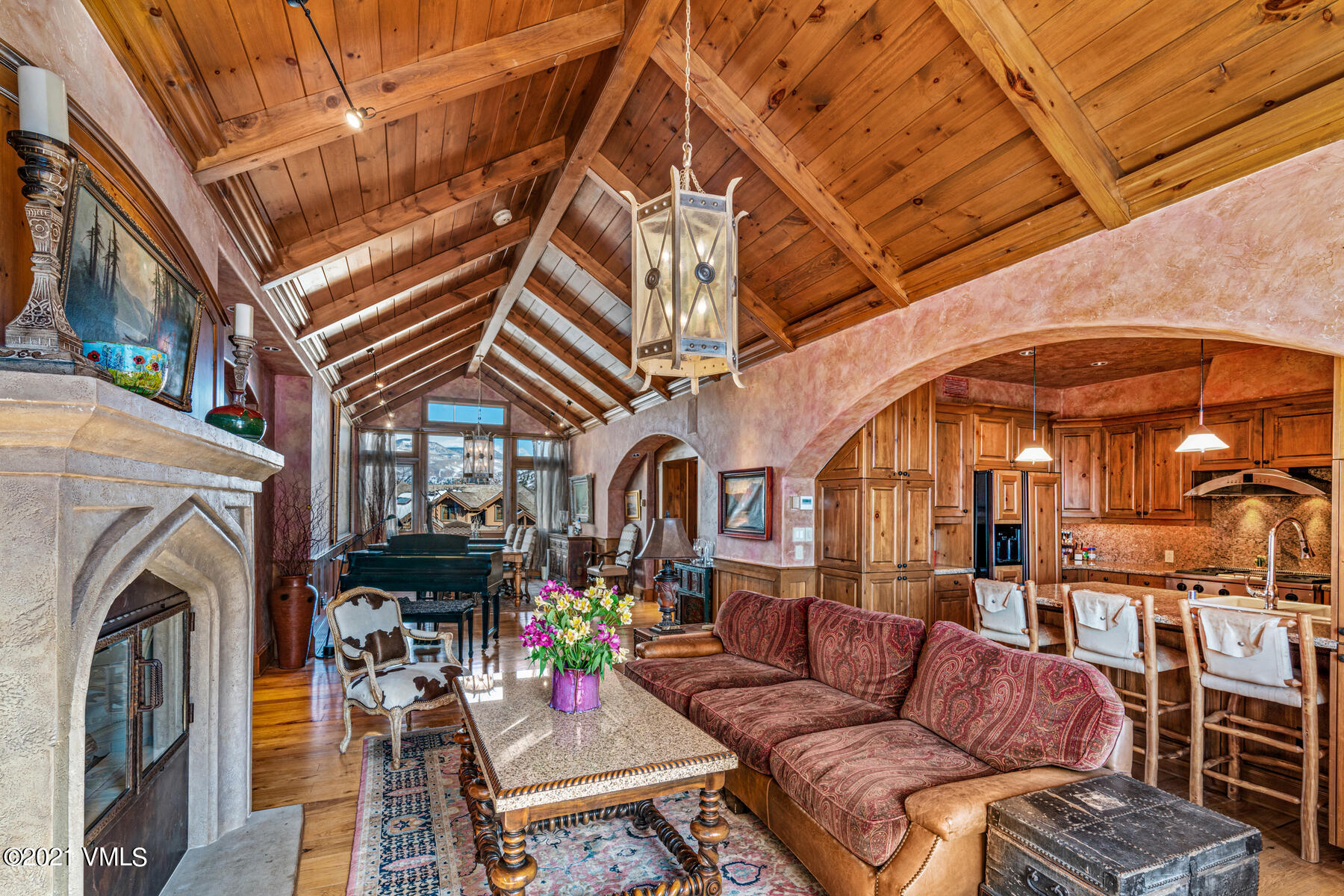 160 Cresta Road, Unit R501 Edwards, CO 81632 - Photo 12 of 21 a living room with furniture a fireplace and a chandelier