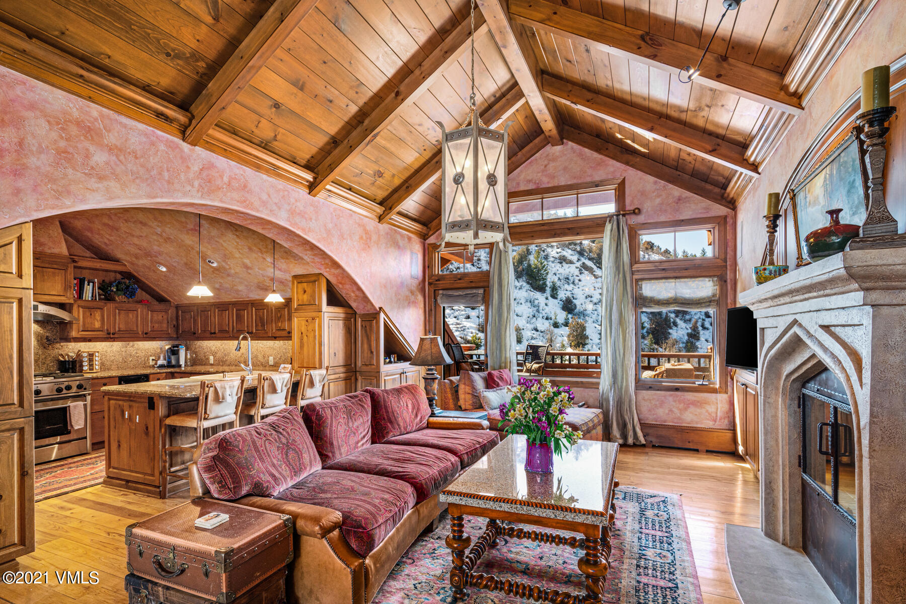 160 Cresta Road, Unit R501 Edwards, CO 81632 - Photo 3 of 21 a living room with furniture a fireplace and a large window