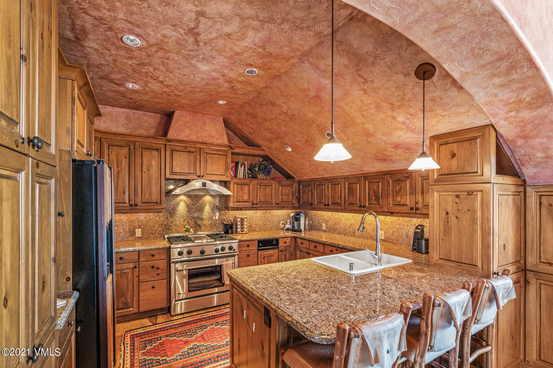160 Cresta Road, Unit R501 Edwards, CO 81632 - Photo 5 of 21 a kitchen with stainless steel appliances granite countertop a sink and cabinets