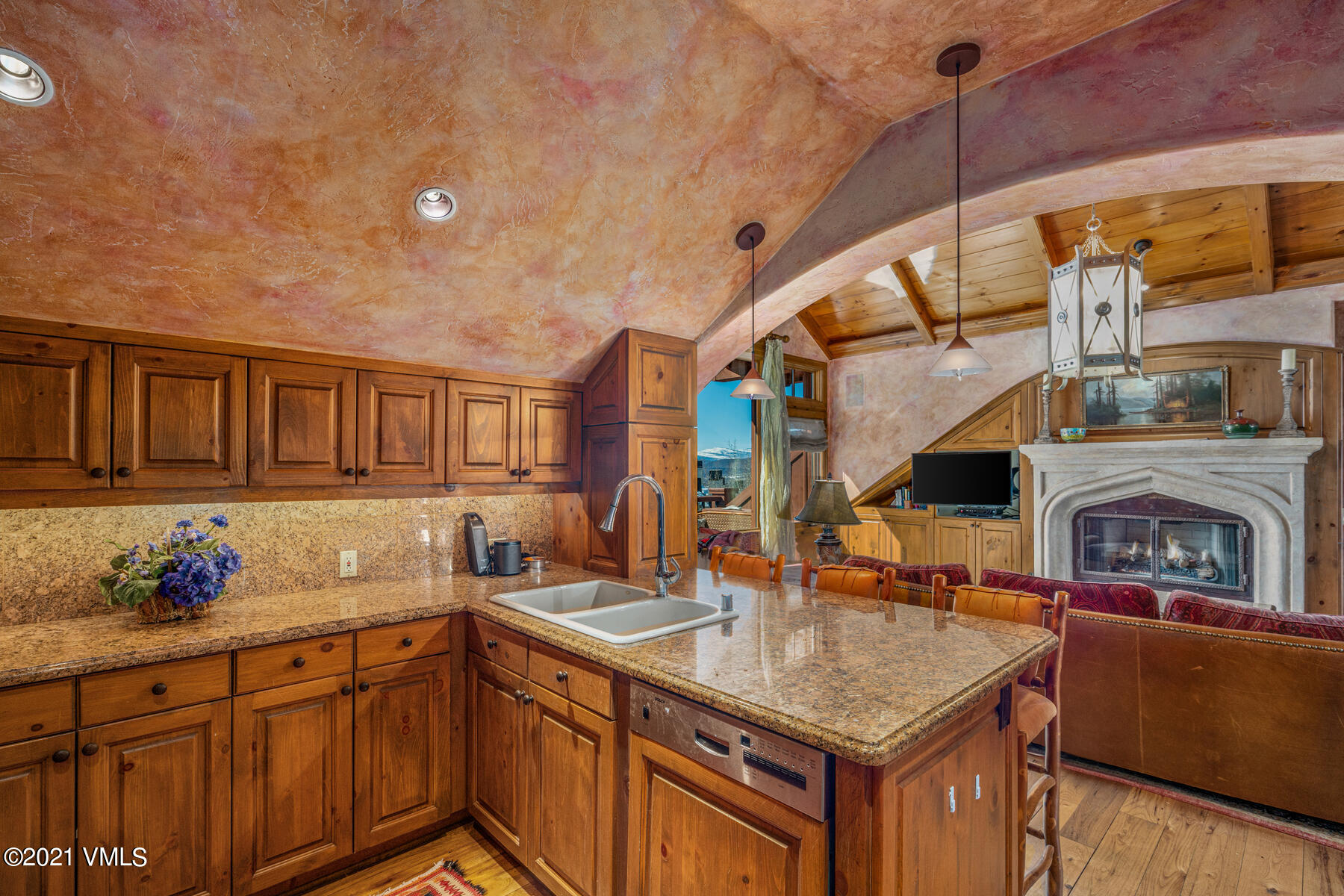 160 Cresta Road, Unit R501 Edwards, CO 81632 - Photo 6 of 21 a kitchen with stainless steel appliances granite countertop a sink and cabinets