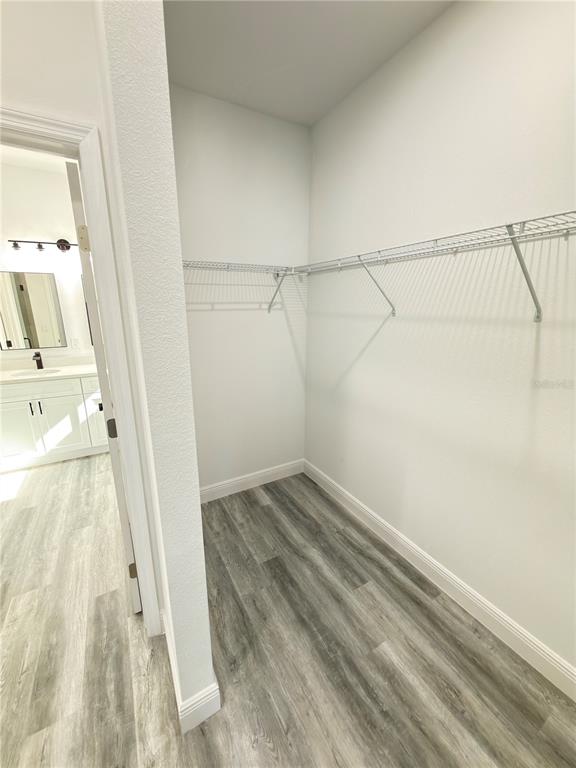 3901 Southwest 161st Loop Ocala, FL 34473 - Photo 16 of 47 a view of a room with racks on the wall