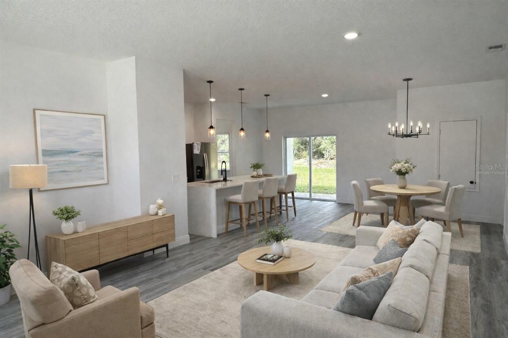 3901 Southwest 161st Loop Ocala, FL 34473 - Photo 2 of 47 a living room with furniture and wooden floor