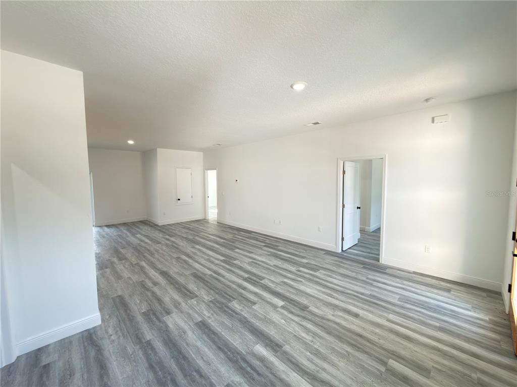 3901 Southwest 161st Loop Ocala, FL 34473 - Photo 24 of 47 wooden floor in an empty room with wooden floor