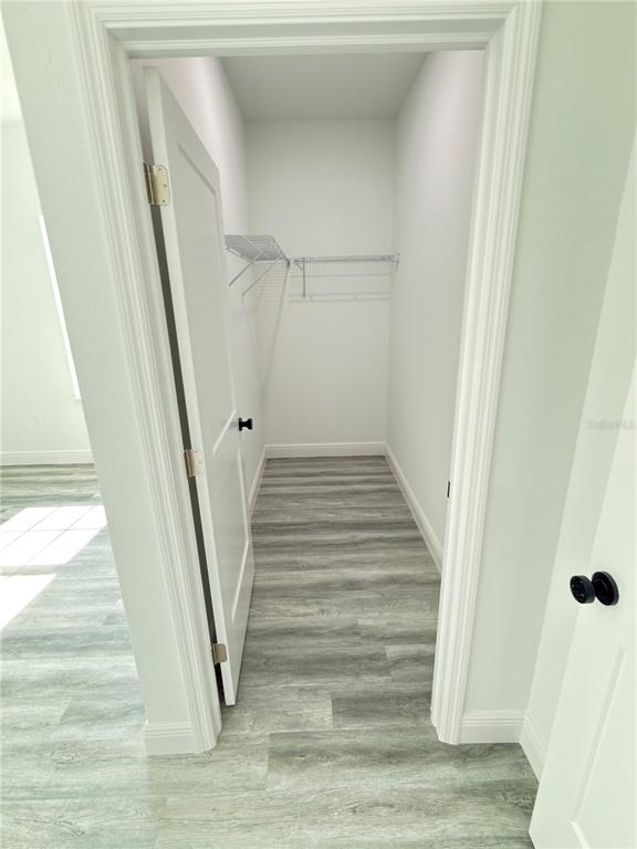 3901 Southwest 161st Loop Ocala, FL 34473 - Photo 26 of 47 a view of entryway and hall with wooden floor