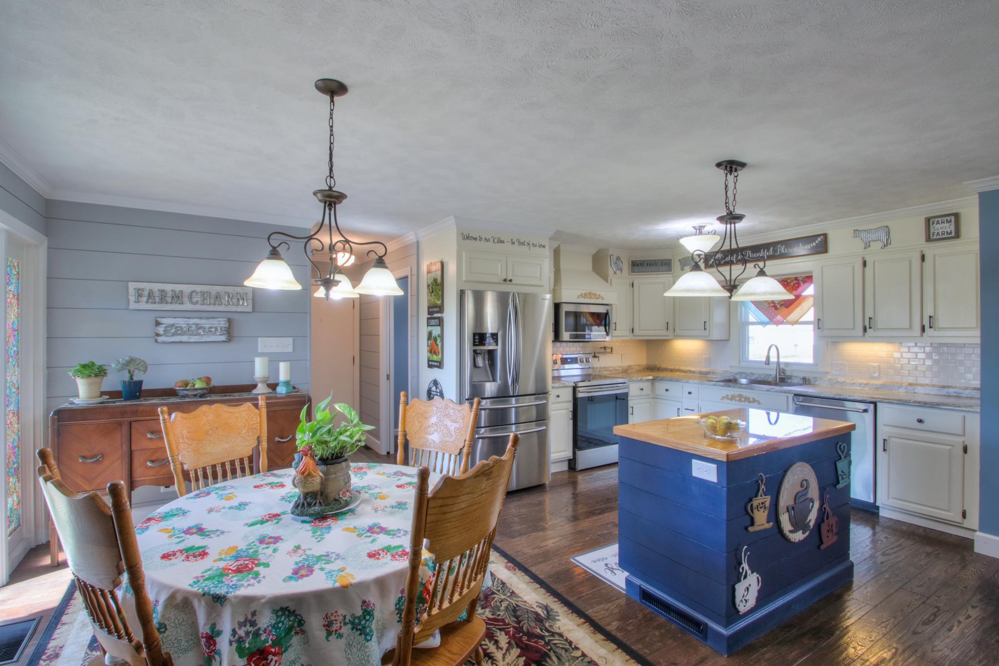 258 Cedar Park Road Centerville, TN 37033 - Photo 12 of 30 Dining room connects with the kitchen completing the open concept feel. Check out the ship lap walls!