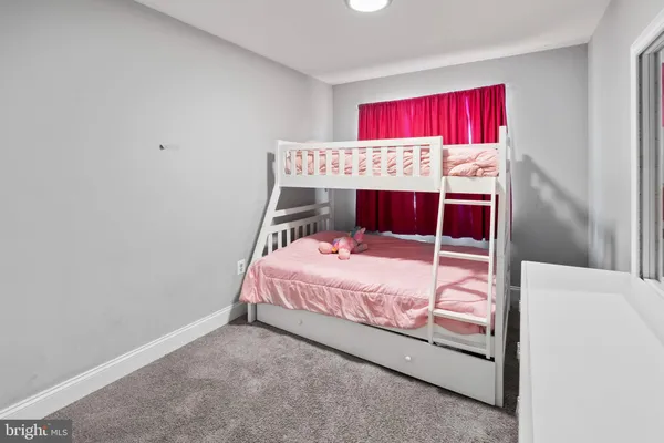 a bed room with a bed and a couch