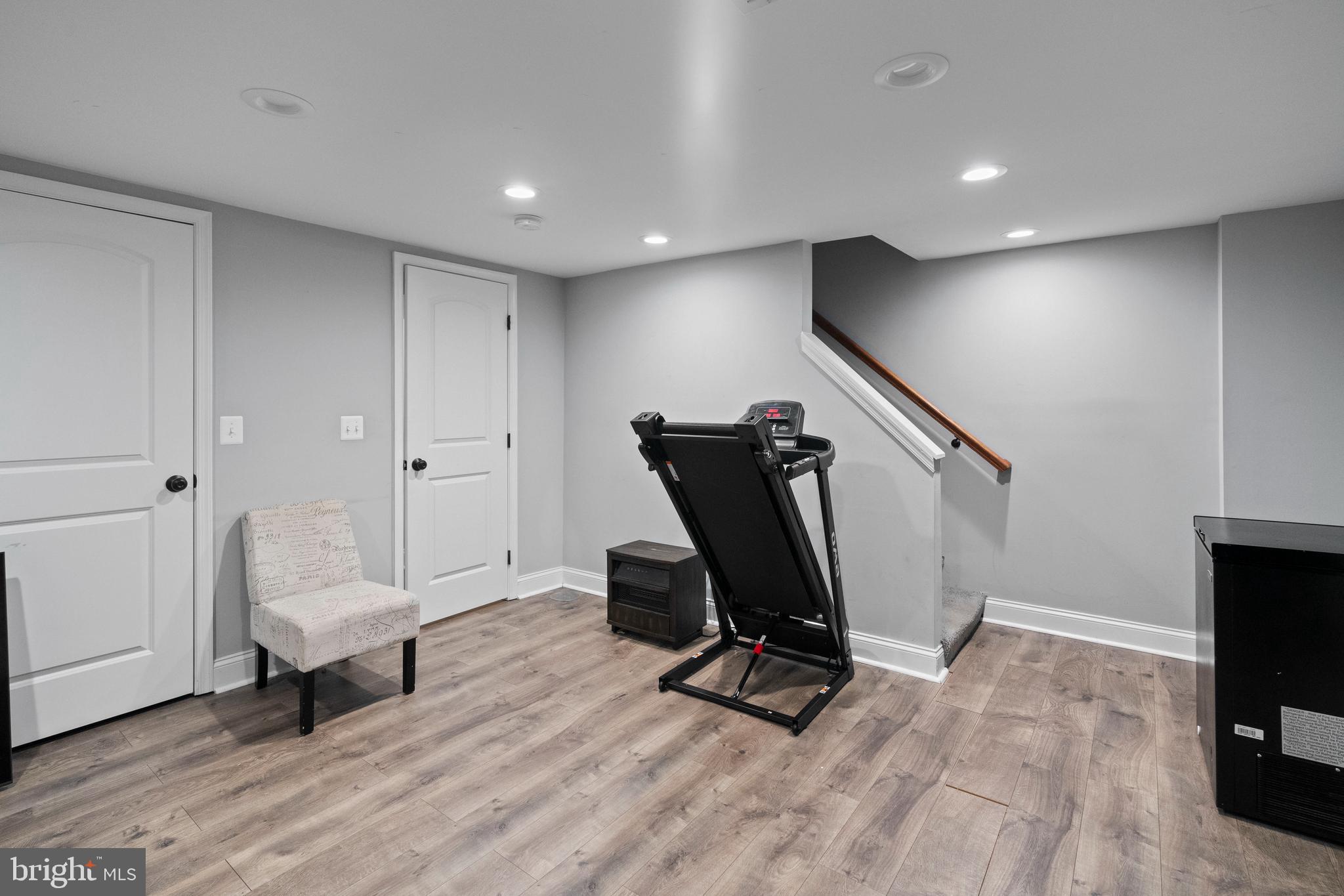 4237 Flowerton Road Baltimore, MD 21229 - Photo 18 of 27 a view of a workspace with furniture and a wooden floor