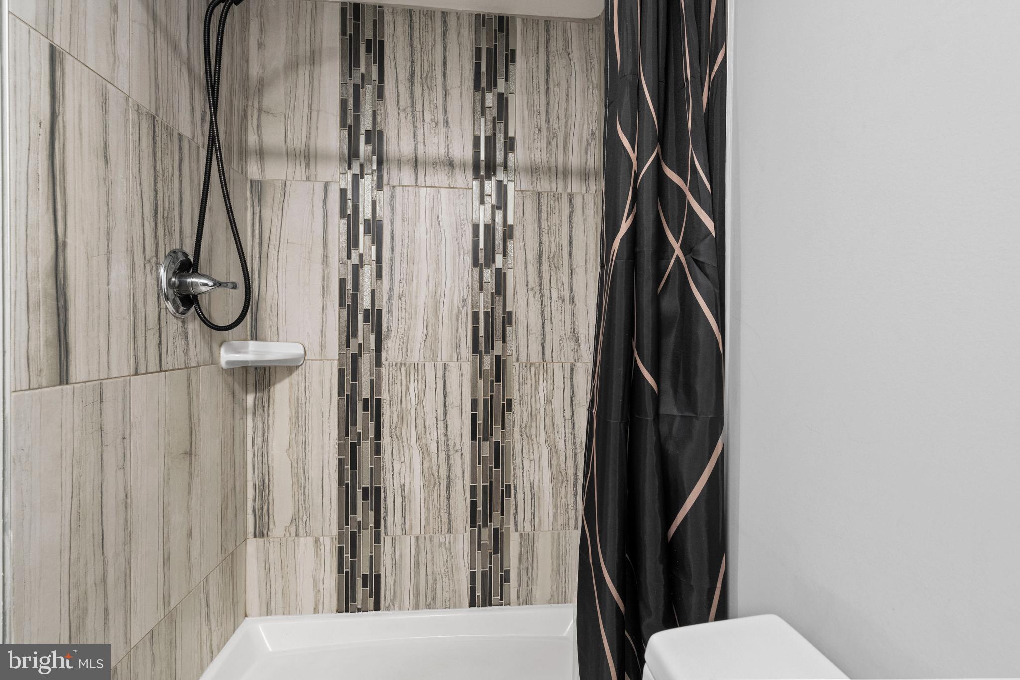 4237 Flowerton Road Baltimore, MD 21229 - Photo 22 of 27 a bathroom with a shower