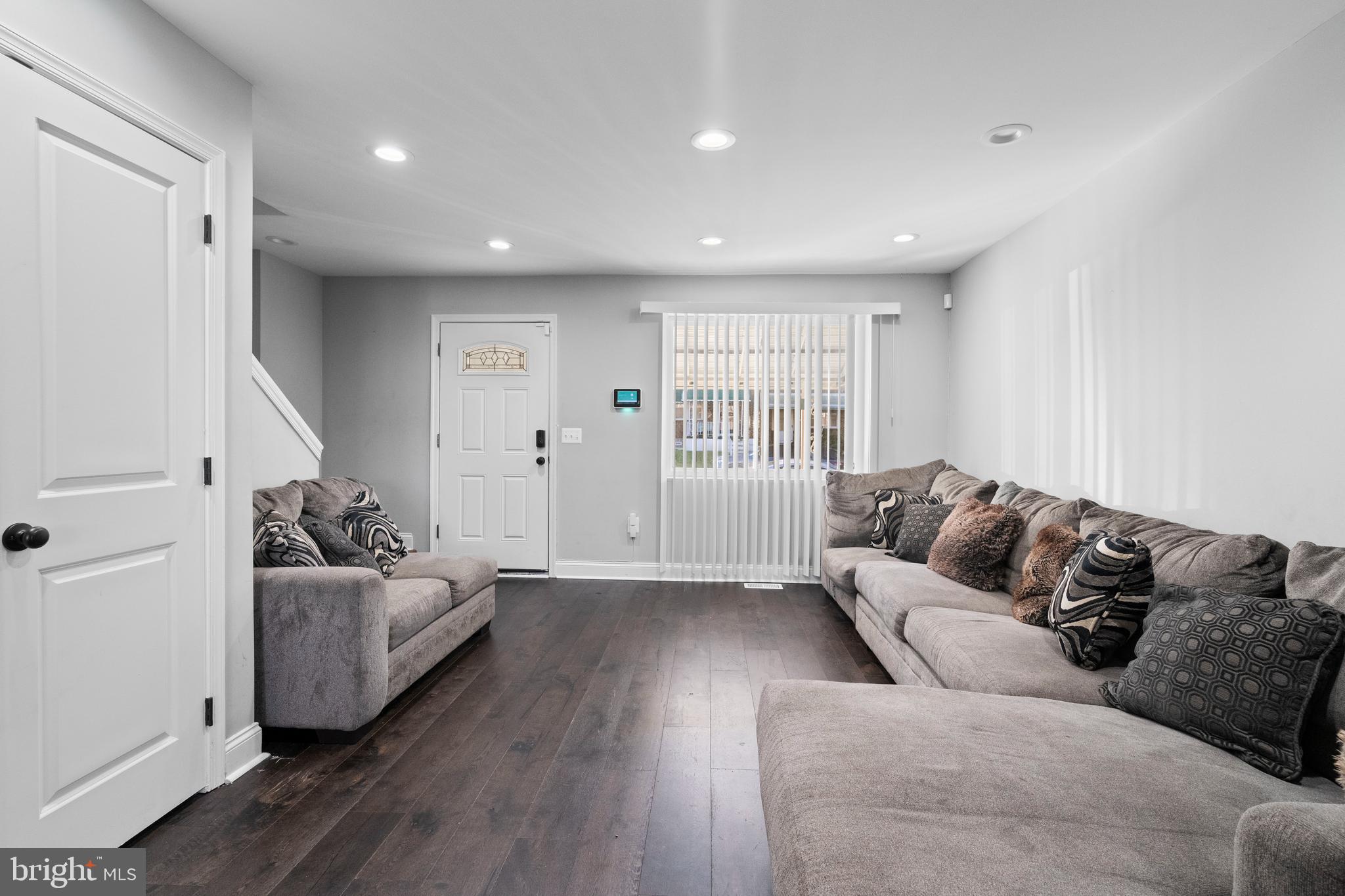 4237 Flowerton Road Baltimore, MD 21229 - Photo 4 of 27 a living room with furniture and a couch