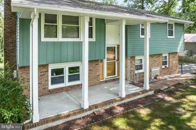 a view of a house with a backyard of a house
