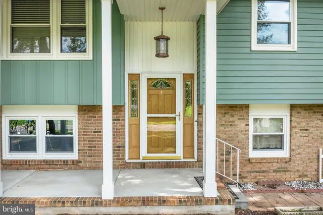 a front view of a house with a glass windows