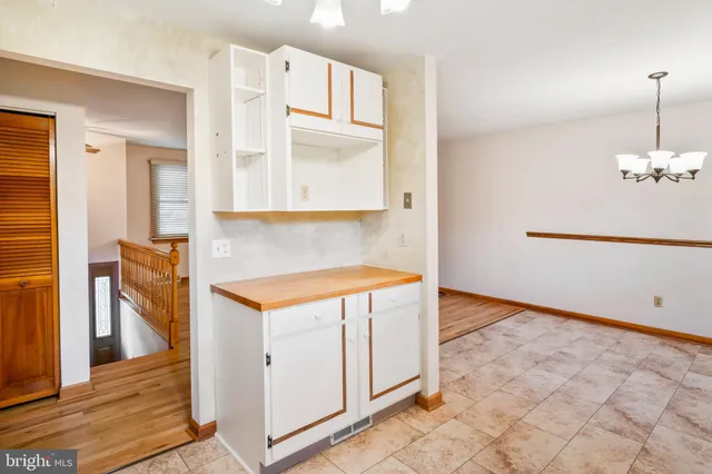a view of a room that has a bed and a window