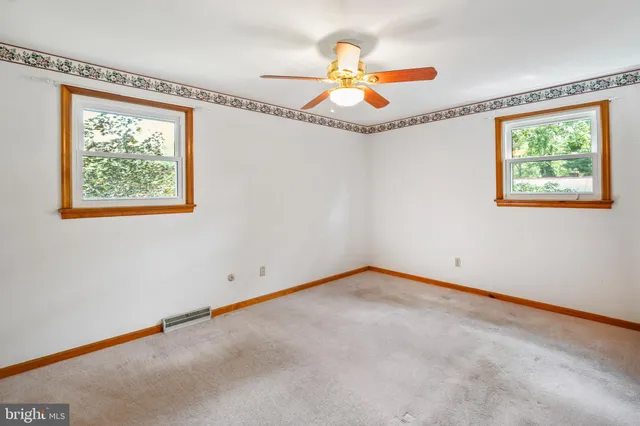 a view of an empty room with a window