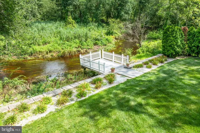 a view of a lake with a house in the background